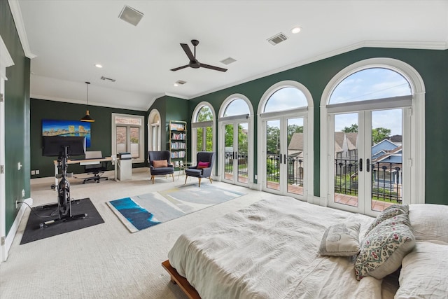 carpeted bedroom featuring access to outside, multiple windows, and french doors