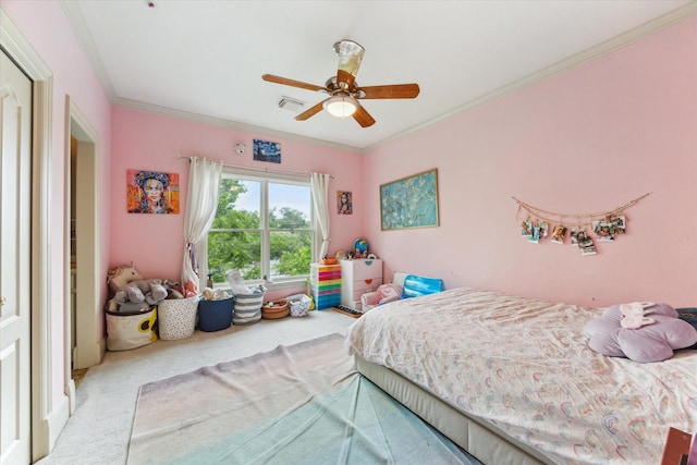 bedroom with crown molding, ceiling fan, visible vents, and carpet