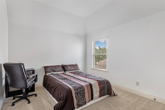 bedroom featuring baseboards and carpet
