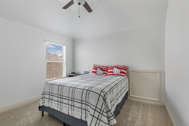 bedroom with carpet floors, baseboards, a ceiling fan, and vaulted ceiling