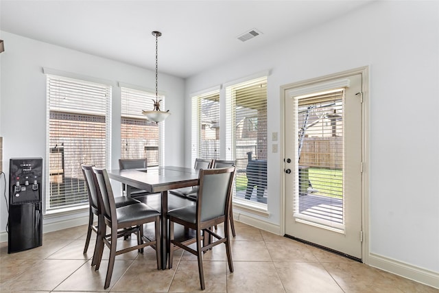 dining area featuring visible vents, baseboards, and light tile patterned floors