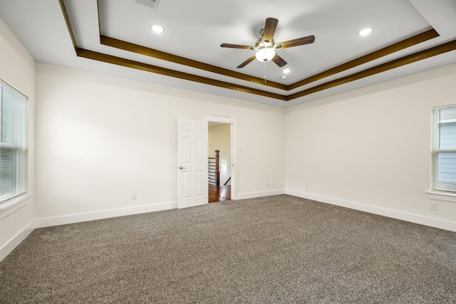 4610 Cashel Glen Dr, Houston, TX 77069 - unfurnished room featuring dark carpet, baseboards, recessed lighting, a tray ceiling, and a ceiling fan
