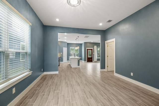 4610 Cashel Glen Dr, Houston, TX 77069 - interior space with visible vents, light wood-style floors, baseboards, and an inviting chandelier