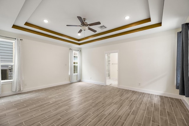 4610 Cashel Glen Dr, Houston, TX 77069 - spare room featuring a ceiling fan, visible vents, wood finished floors, a raised ceiling, and baseboards