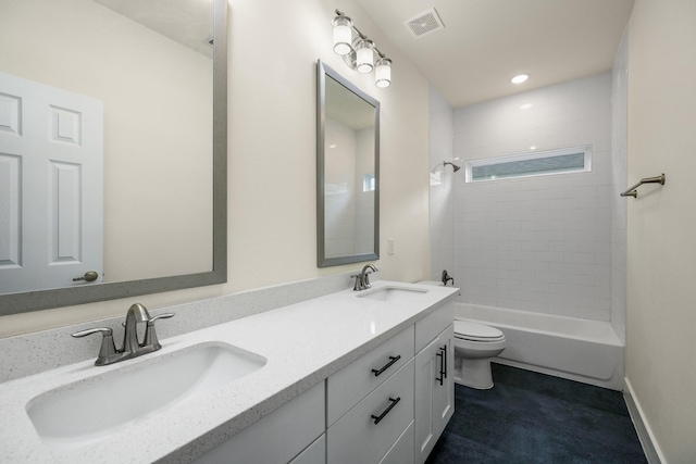 4610 Cashel Glen Dr, Houston, TX 77069 - bathroom with visible vents, a sink, double vanity, and toilet