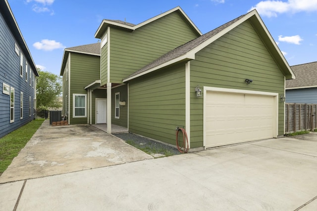 4610 Cashel Glen Dr, Houston, TX 77069 - view of front of house featuring fence, driveway, and a shingled roof