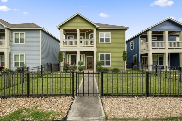 4610 Cashel Glen Dr, Houston, TX 77069 - view of front of property featuring a gate, a front lawn, a fenced front yard, and a balcony