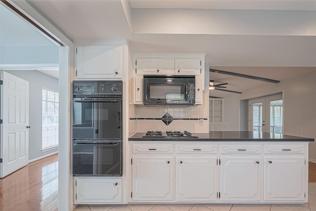 16506 Amcreek Rd, Houston, TX 77068 - kitchen featuring white cabinets, ceiling fan, black appliances, and dark countertops