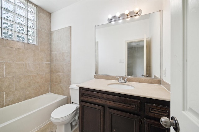 full bathroom featuring vanity, washtub / shower combination, and toilet