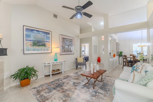 3511 Lost Oak Dr, Spring, TX 77388 - living area featuring light tile patterned flooring, visible vents, ceiling fan with notable chandelier, baseboards, and vaulted ceiling