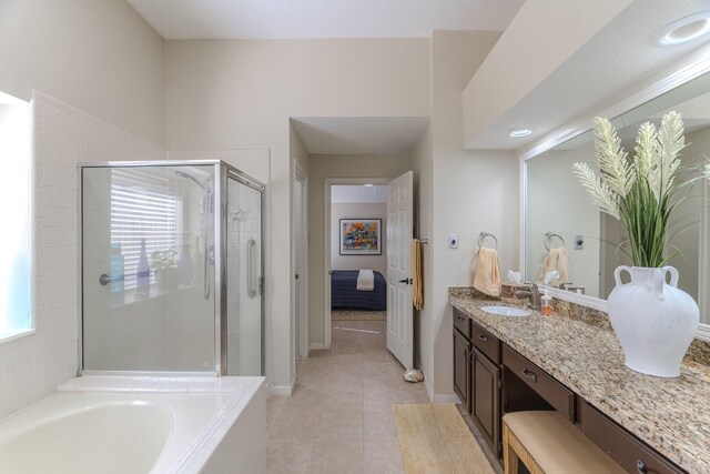 3511 Lost Oak Dr, Spring, TX 77388 - full bathroom with tile patterned flooring, vanity, baseboards, a bath, and a stall shower