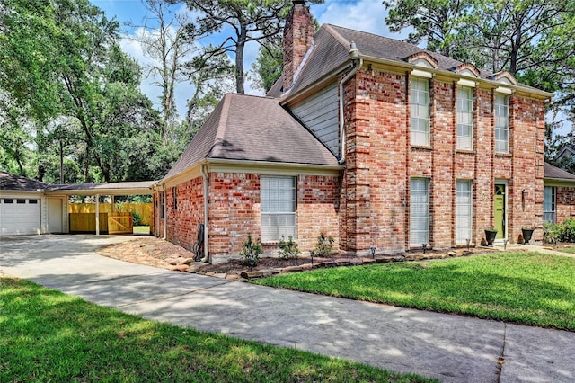 view of property exterior with fence, a yard, concrete driveway, and brick siding