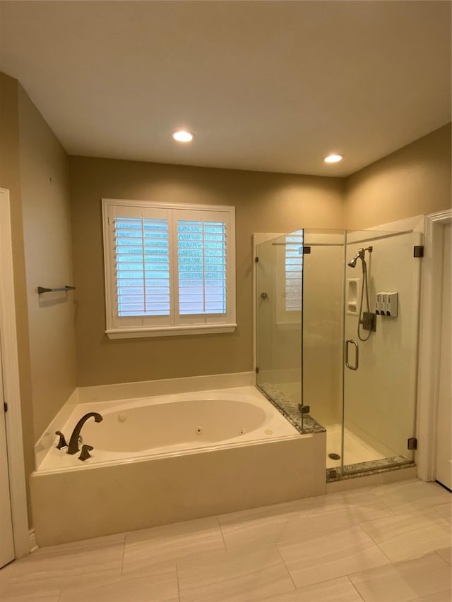 bathroom with tile patterned flooring, a whirlpool tub, a stall shower, and recessed lighting