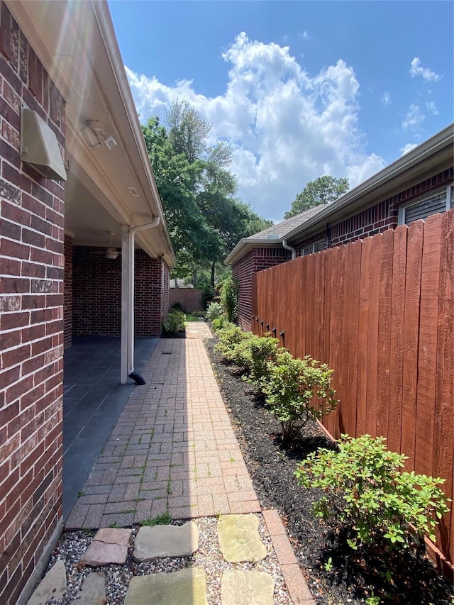view of patio / terrace featuring fence