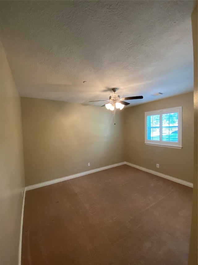 unfurnished room featuring baseboards, a ceiling fan, carpet flooring, and a textured ceiling