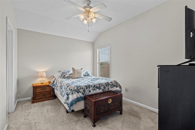 carpeted bedroom featuring baseboards, ceiling fan, and lofted ceiling