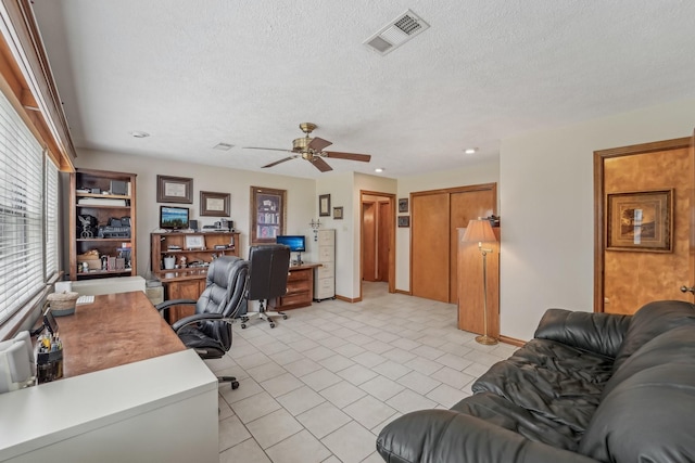 office area featuring visible vents, ceiling fan, recessed lighting, a textured ceiling, and light tile patterned floors