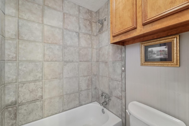 bathroom with shower / bath combination and toilet