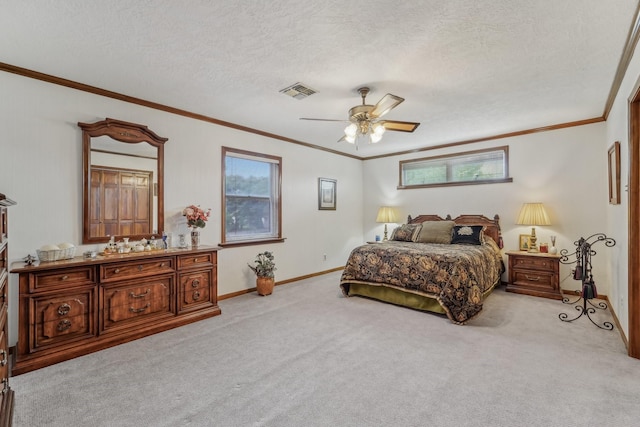 carpeted bedroom featuring a textured ceiling, a ceiling fan, baseboards, visible vents, and ornamental molding