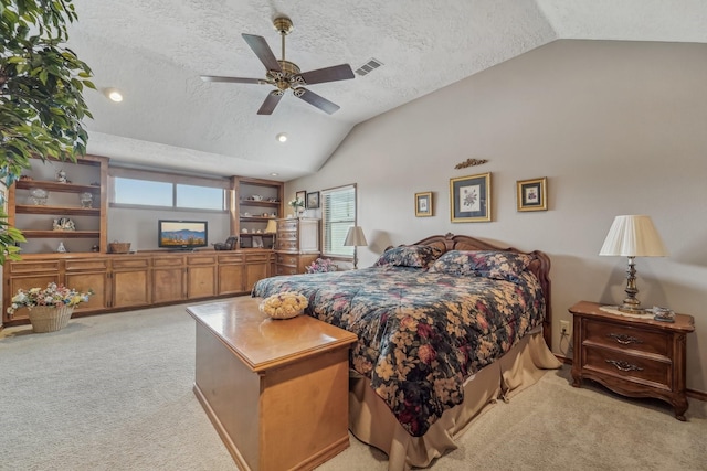 bedroom featuring light colored carpet, vaulted ceiling, multiple windows, and visible vents