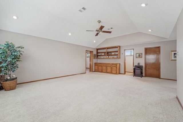 unfurnished living room with baseboards, recessed lighting, and light colored carpet