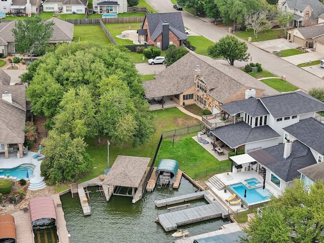 aerial view featuring a residential view and a water view