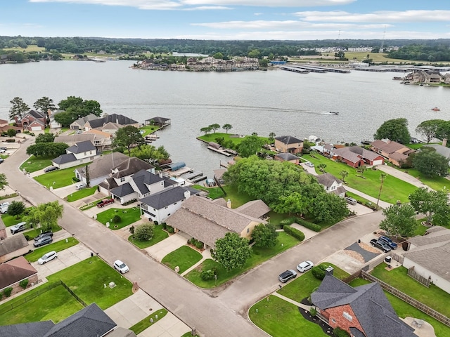 birds eye view of property with a water view and a residential view