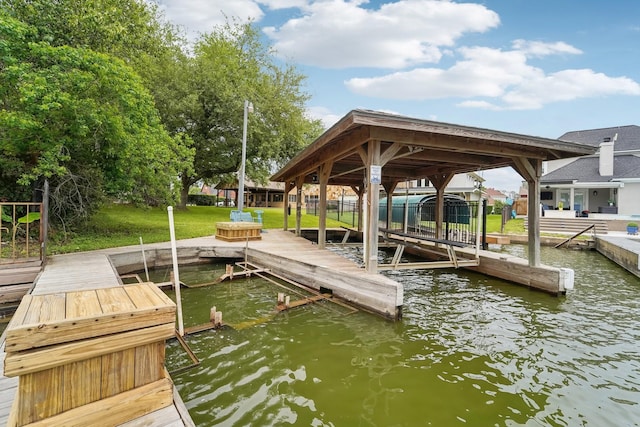 view of dock with a water view and boat lift