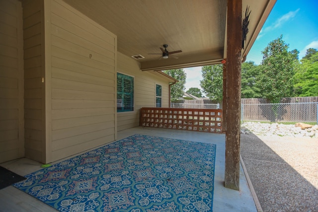 view of patio with a ceiling fan, visible vents, and fence