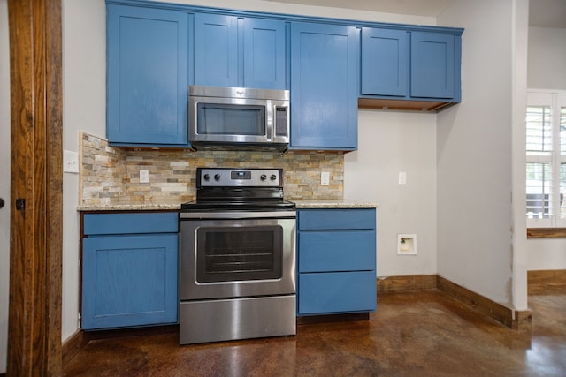kitchen with finished concrete flooring, appliances with stainless steel finishes, tasteful backsplash, and blue cabinetry