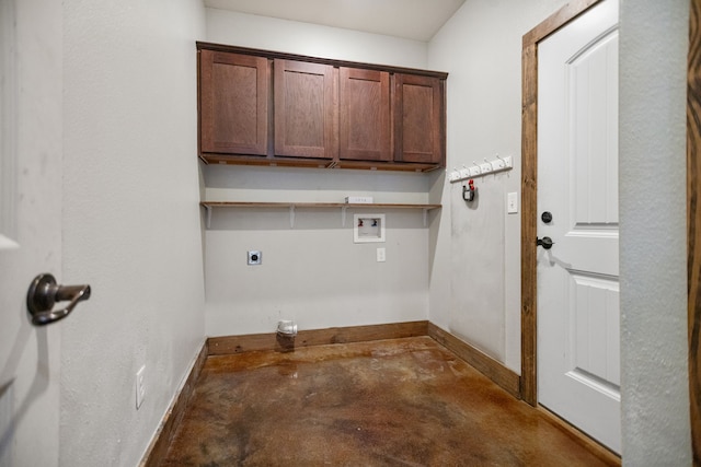 washroom with baseboards, washer hookup, electric dryer hookup, and cabinet space