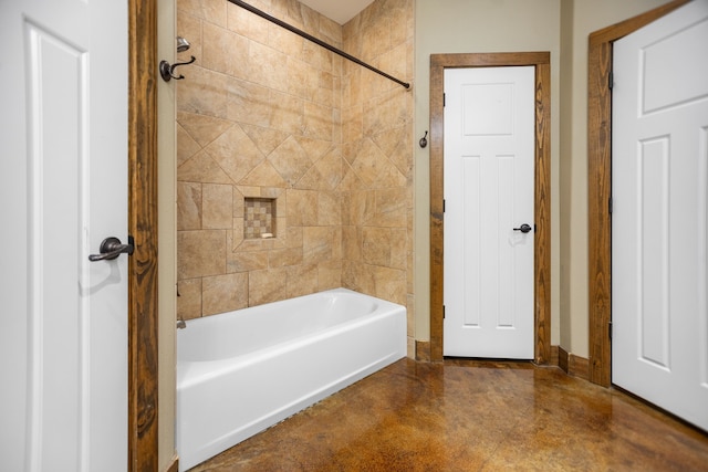 full bathroom featuring shower / bathtub combination, baseboards, and finished concrete floors