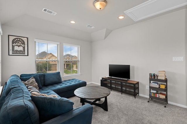 living room featuring baseboards, visible vents, light carpet, and lofted ceiling