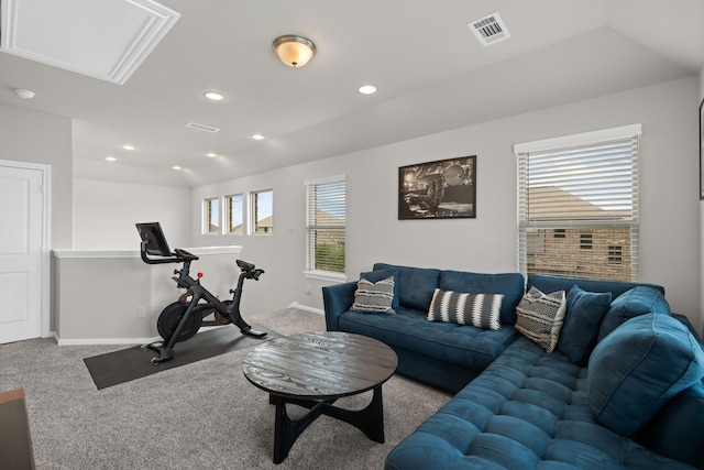 carpeted living area featuring baseboards, vaulted ceiling, recessed lighting, and visible vents