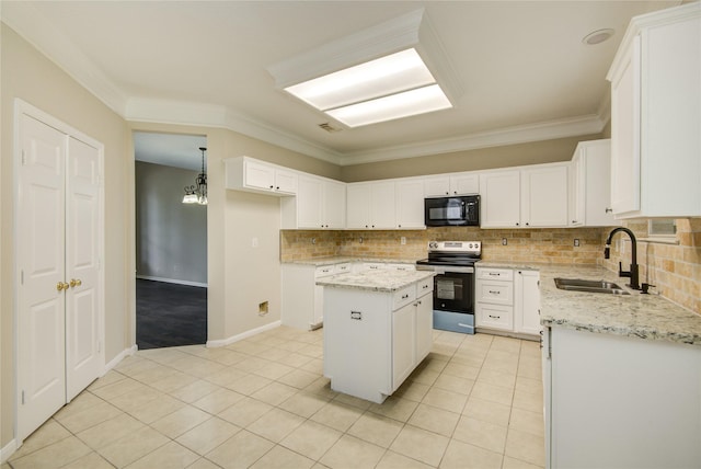 107 Mango St, Lake Jackson, TX 77566 - kitchen featuring decorative backsplash, a kitchen island, black microwave, a sink, and stainless steel range with electric cooktop
