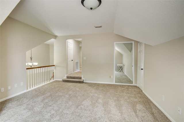 107 Mango St, Lake Jackson, TX 77566 - bonus room with an inviting chandelier, carpet flooring, lofted ceiling, and visible vents