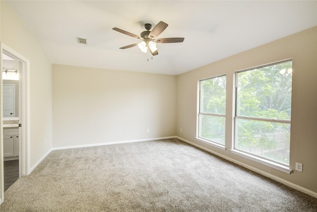 107 Mango St, Lake Jackson, TX 77566 - empty room featuring carpet floors, visible vents, and a wealth of natural light