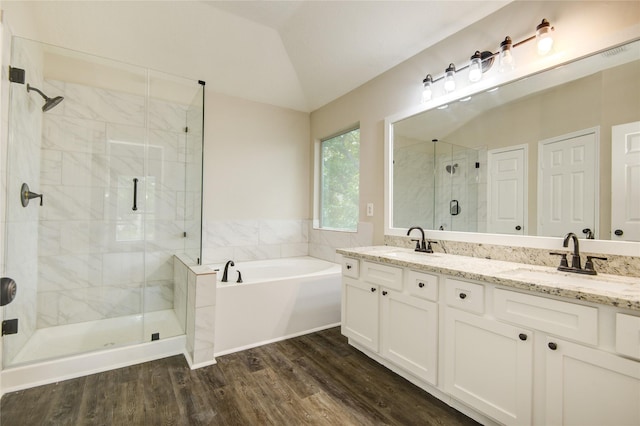 107 Mango St, Lake Jackson, TX 77566 - bathroom with wood finished floors, a sink, a bath, and a stall shower