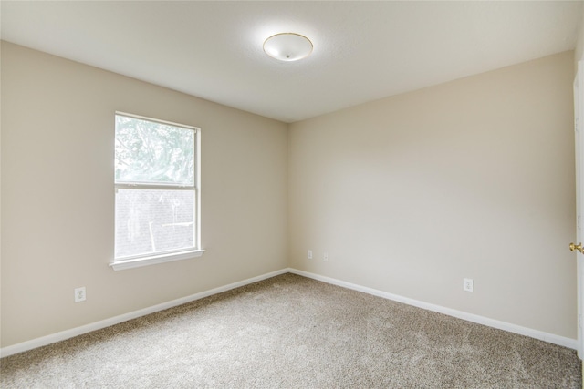 107 Mango St, Lake Jackson, TX 77566 - carpeted empty room featuring baseboards
