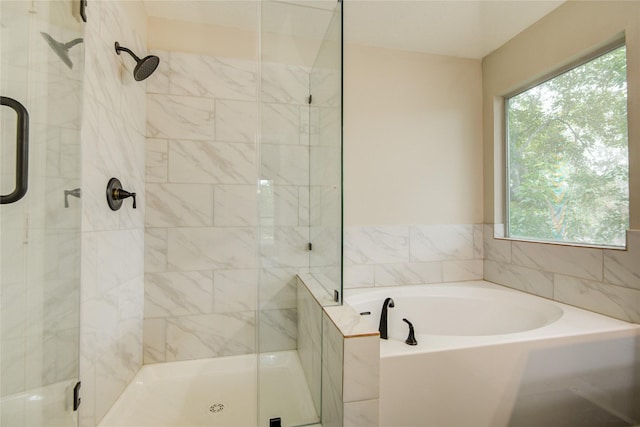 107 Mango St, Lake Jackson, TX 77566 - bathroom featuring plenty of natural light, a stall shower, and a garden tub