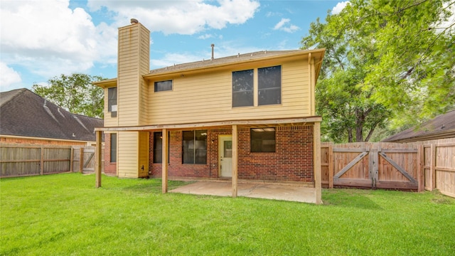 107 Mango St, Lake Jackson, TX 77566 - rear view of house with a chimney, a lawn, a gate, a fenced backyard, and a patio