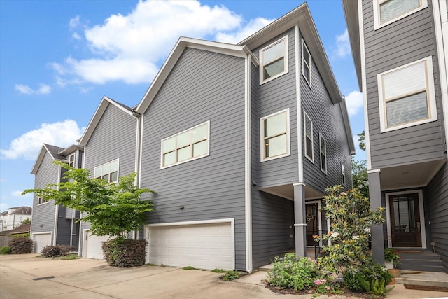 1230 W 25th St Unit C, Houston, TX 77008 - view of front of property with concrete driveway and a garage