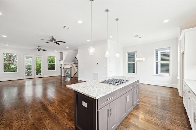 1230 W 25th St Unit C, Houston, TX 77008 - kitchen featuring ceiling fan with notable chandelier, baseboards, stainless steel gas cooktop, and dark wood finished floors