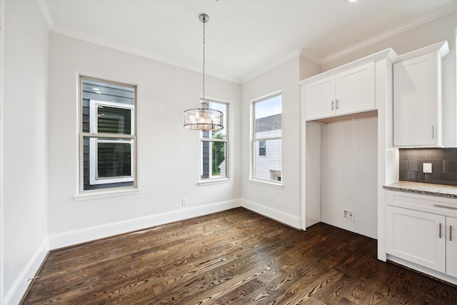 1230 W 25th St Unit C, Houston, TX 77008 - unfurnished dining area featuring baseboards, dark wood-style flooring, an inviting chandelier, and crown molding