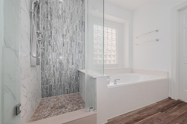 15014 Cabin Run Ln, Sugar Land, TX 77498 - bathroom with walk in shower, a bath, and wood finished floors