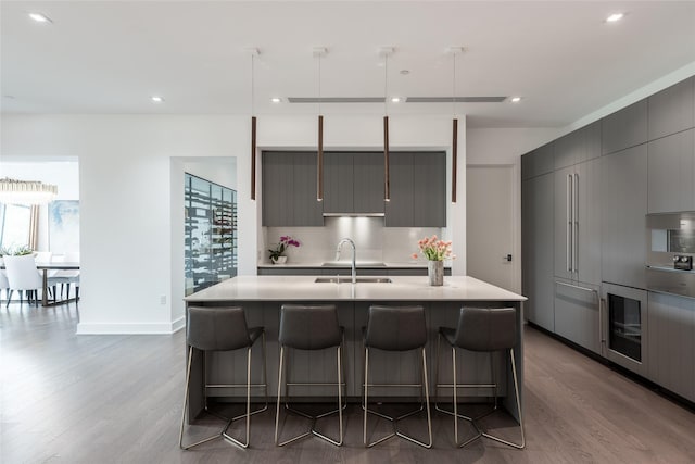 2710 Steel St Unit 301, Houston, TX 77098 - kitchen with modern cabinets, a sink, light countertops, dark wood-style floors, and recessed lighting