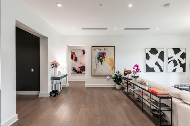interior space featuring baseboards, recessed lighting, and wood finished floors
