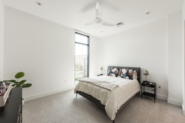 2710 Steel St Unit 301, Houston, TX 77098 - bedroom with baseboards, carpet, and ceiling fan