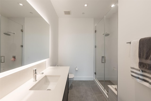 full bath with visible vents, a stall shower, toilet, and vanity