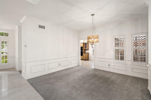 4423 Nassau Dr, Sugar Land, TX 77479 - interior space with crown molding, a decorative wall, a chandelier, a wainscoted wall, and visible vents